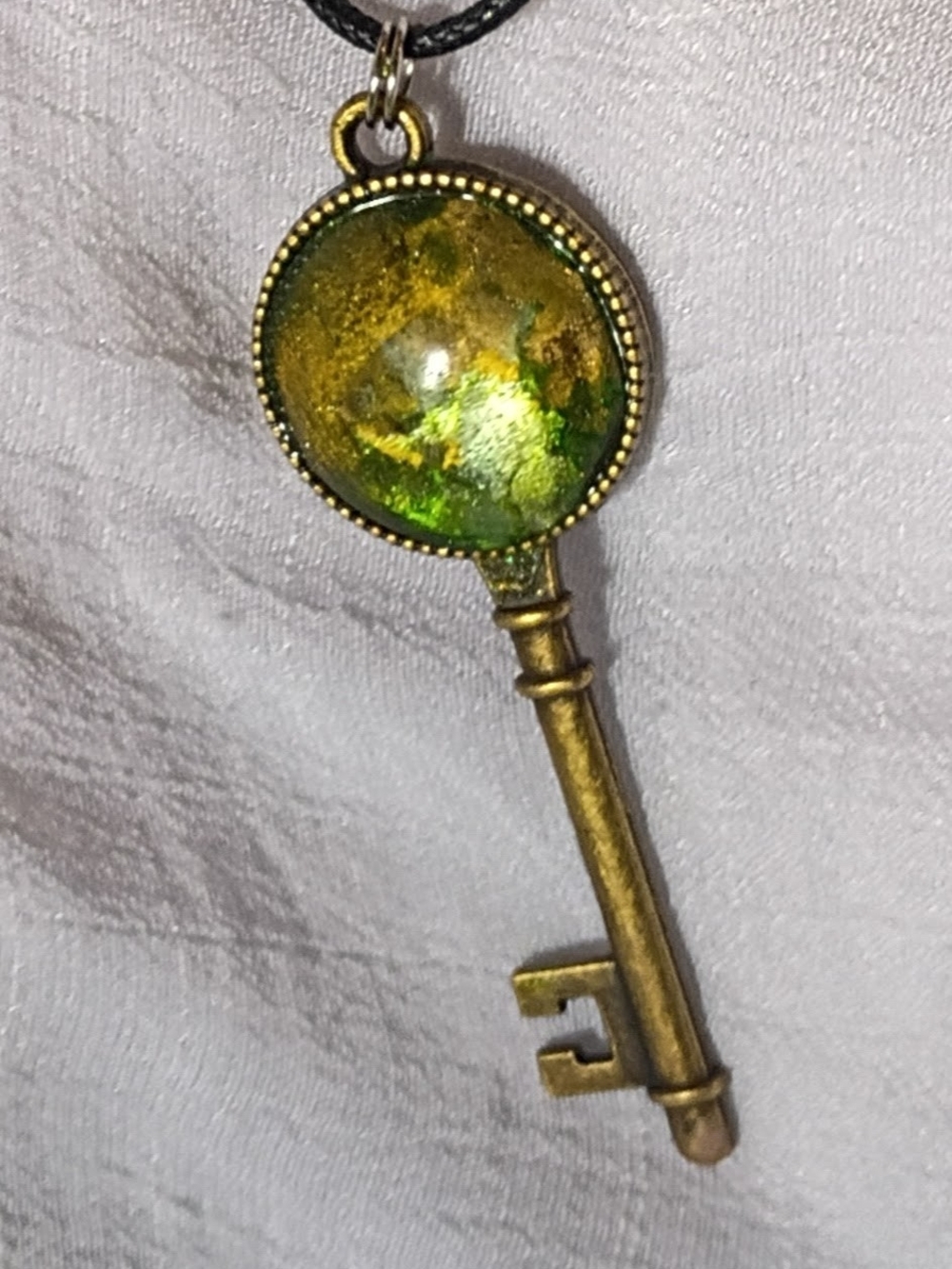 Antique Brass Key Pendant with Green Glass Cabochon